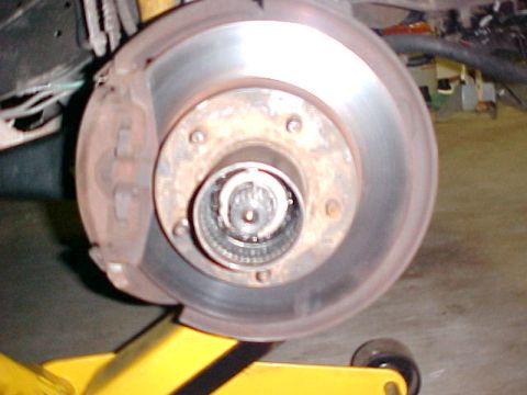 1996 Ford Bronco - Close-up view of a vehicle's hub and brake rotor assembly.