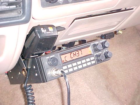 1996 Ford Bronco - Interior view of a vehicle's dashboard with a CB radio and microphone installed.