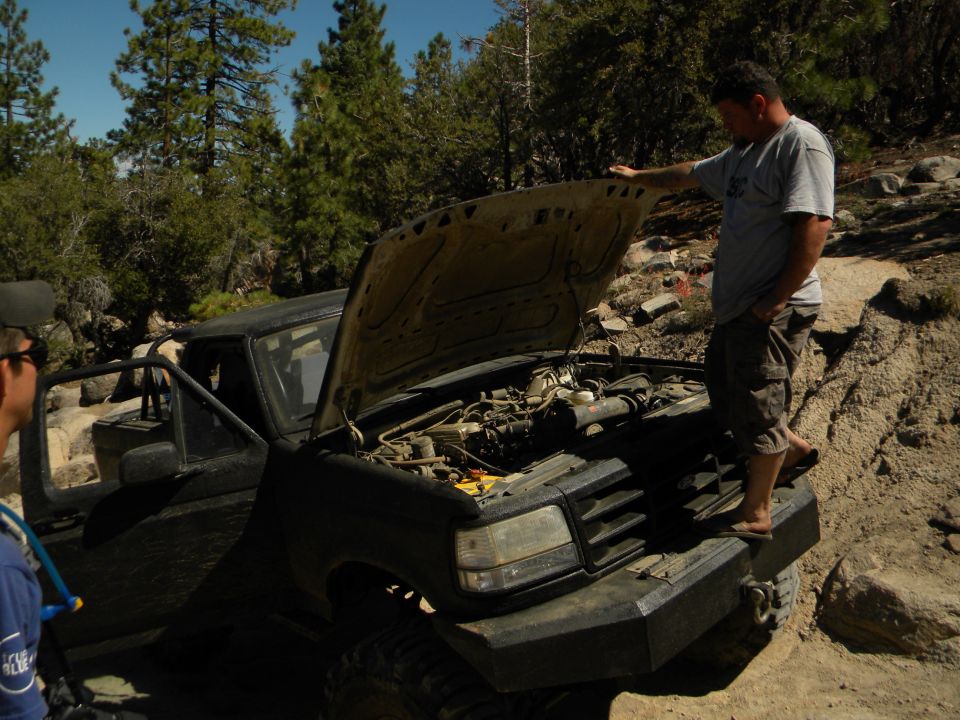 1992 Ford Bronco front view with hood open, showing engine and custom bumper