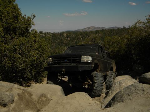 1992 Ford Bronco - This 1992 Ford Bronco is shown off-roading on a challenging rocky path.
