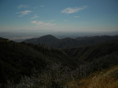 Mountain landscape with distant haze and clouds