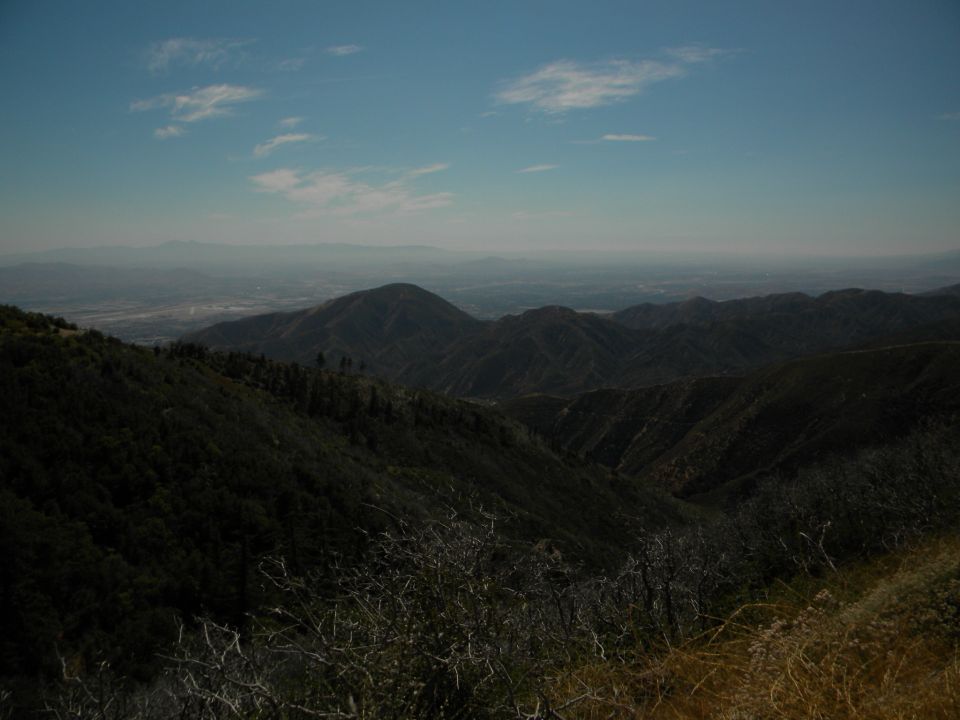 Mountain landscape with distant haze and clouds