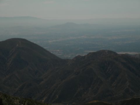 Hazy mountain range with a valley in the distance