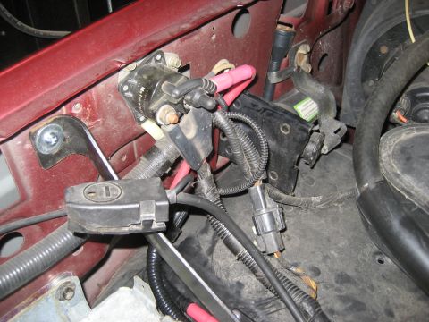 1996 Ford Bronco - Close-up view of engine bay wiring and components, a starter solenoid and fuse box.