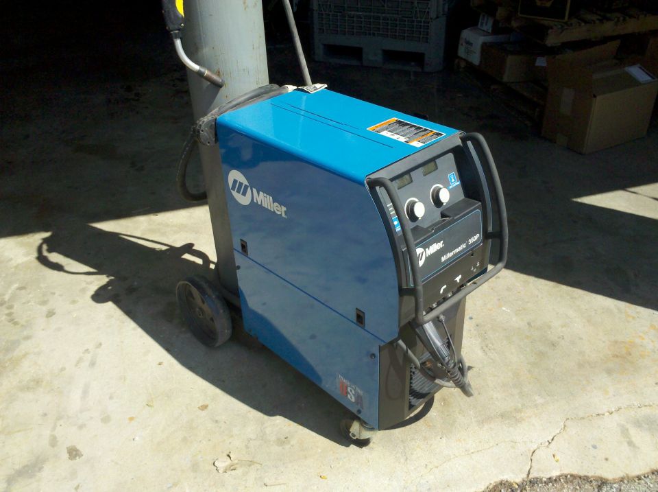 Blue Miller Millermatic 250P welding machine with gas cylinder