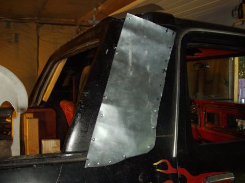 1978 Ford Bronco - A 1978 Ford Bronco is undergoing modifications, with a metal plate being attached to its side.