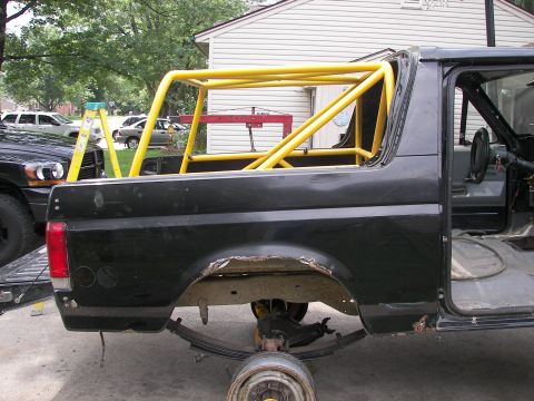 1988 Ford Bronco - This 1988 Ford Bronco is undergoing modifications, a prominent yellow roll cage.