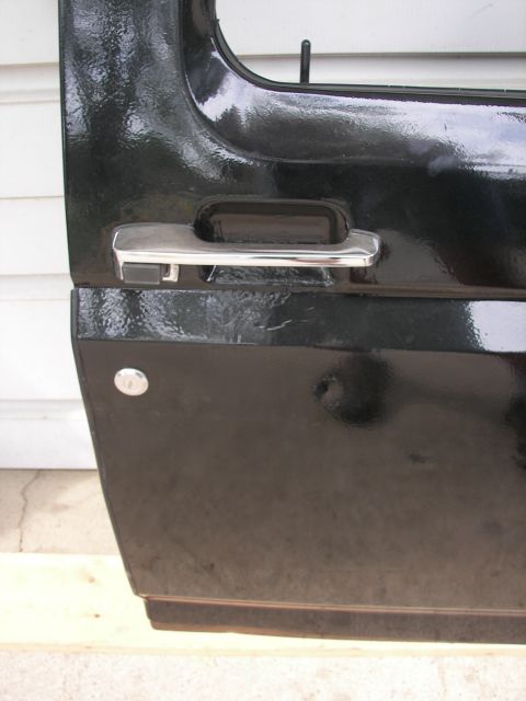 1988 Ford Bronco - Close-up of the exterior door handle and lock mechanism on a 1988 Ford Bronco.