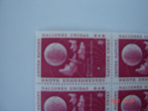 1993 Ford Bronco - A sheet of United Nations stamps celestial imagery and text is partially visible against a light blue background.