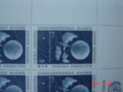 1993 Ford Bronco - A sheet of blue stamps displays celestial bodies and text, with a watermark from Supermotors.net.