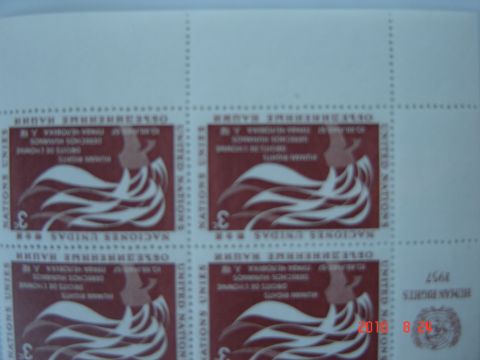 1993 Ford Bronco - A sheet of United Nations stamps a stylized figure and text is partially visible.