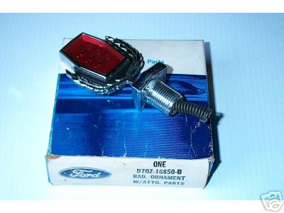 1979 Ford Ranchero - A Ford radiator ornament is shown on its original packaging, which includes a part number.