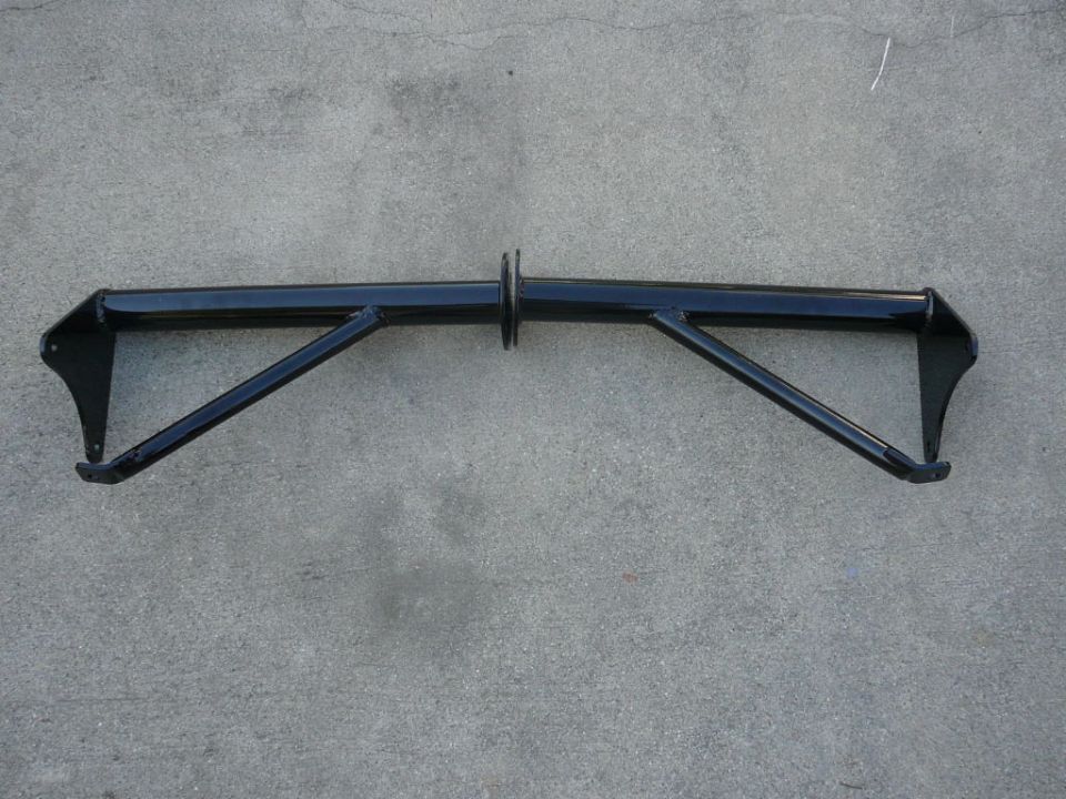 Black metal bar with angled supports, mounted on concrete