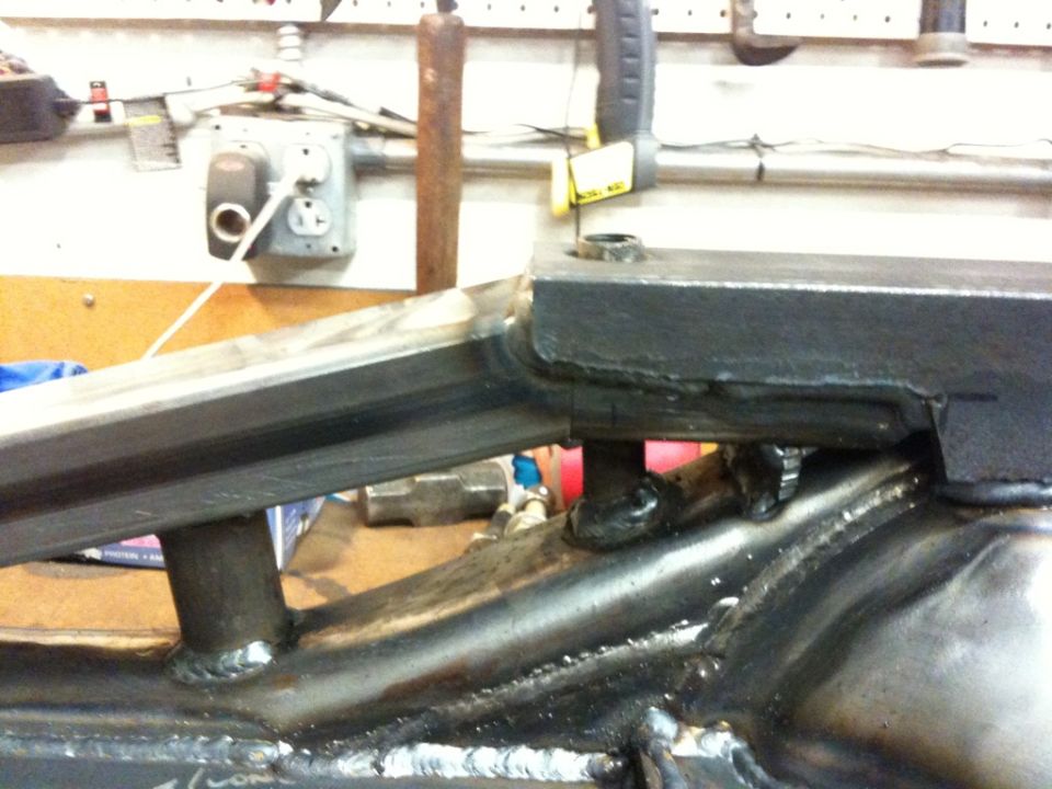 Welded metal frame part with visible Supermotors.net logo