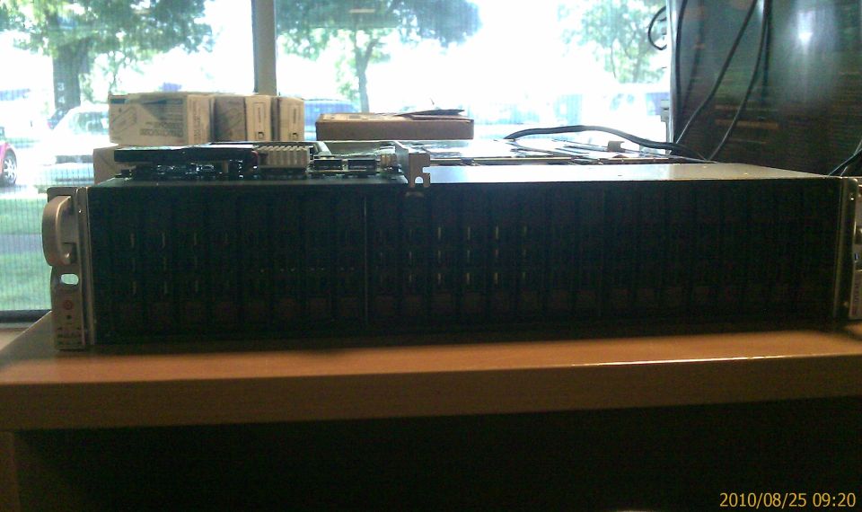 Server rack with visible circuit boards on top, seen from the side