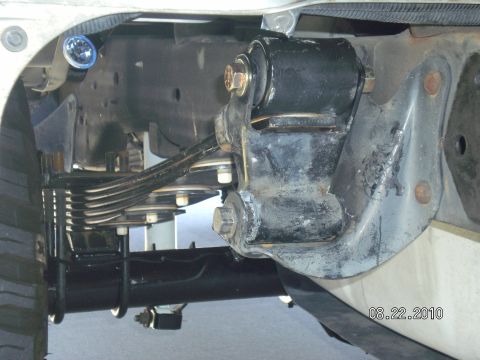1996 Ford Bronco - Suspension lift components are visible in this close-up view, showing leaf springs and a shock absorber mount.