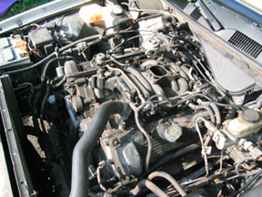 1996 Ford Crown Victoria - Close-up view of the engine compartment, showing various components and a prominent watermark.