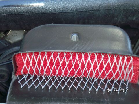 1996 Ford Bronco - Close-up of a red engine air filter with a white mesh protective layer, dated 08.22.2010.