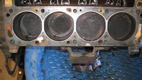 1968 Ford Ranchero - Close-up view of an engine's cylinder head, revealing the condition of the pistons.