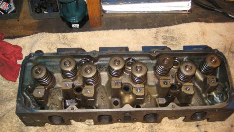 1968 Ford Ranchero - Close-up view of an engine cylinder head, showing internal components like valve springs.