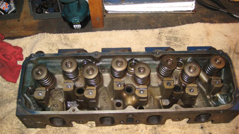 Engine cylinder head with valve springs and rockers visible