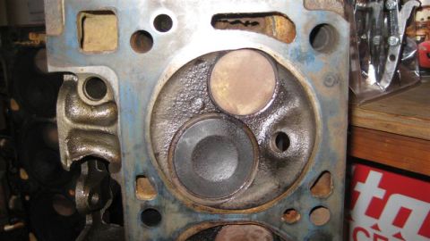 1968 Ford Ranchero - Close-up view of an engine cylinder head, showing the combustion chamber and valve seats.