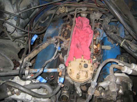 1988 Ford Bronco - Close-up view of an engine bay, showing the distributor cap and surrounding components.