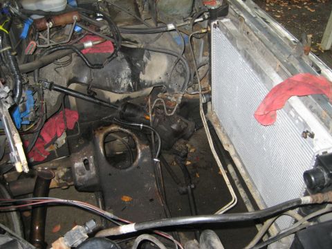 1988 Ford Bronco - Engine bay components, including a radiator and various hoses, are visible in this close-up view.