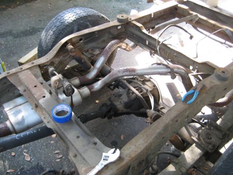 1988 Ford Bronco - Frame and drivetrain components of a 1988 Ford Bronco undergoing rebuild.