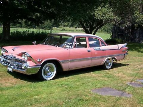 1991 Ford Crown Victoria - 1959 Dodge Custom Royal sedan with distinctive tail fins and chrome accents.