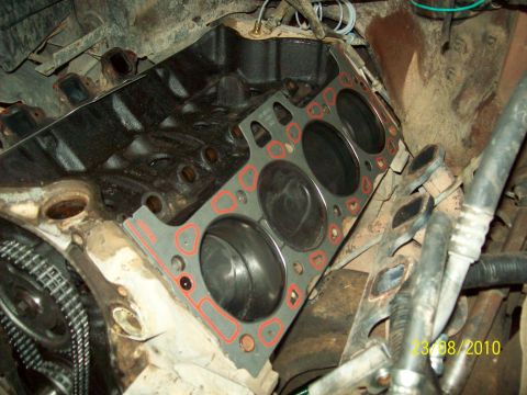 1985 Ford Bronco - Engine block and gasket during repair work.