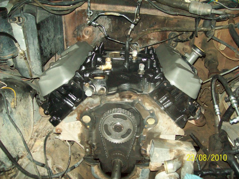 Engine block showing timing chain and gears, with valve covers installed