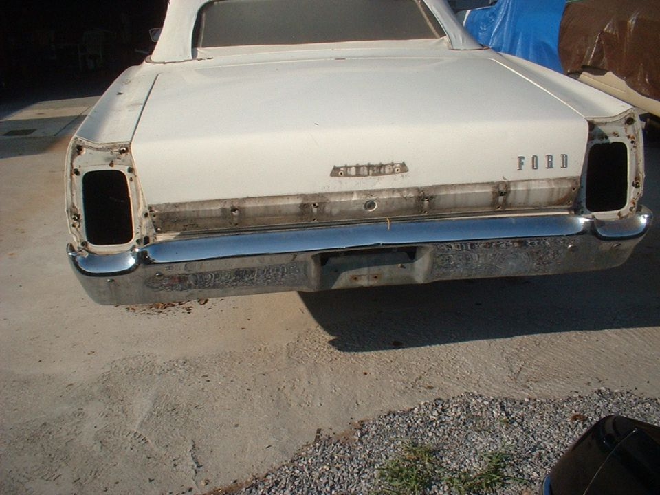 White 1967 Ford Galaxie convertible rear view, missing taillights, chrome bumper