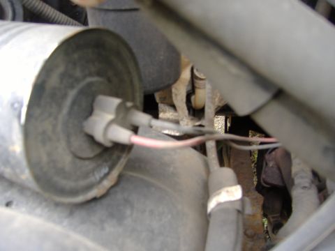 1995 Ford F-150 - Close-up view of an engine part with electrical connectors and wiring visible.