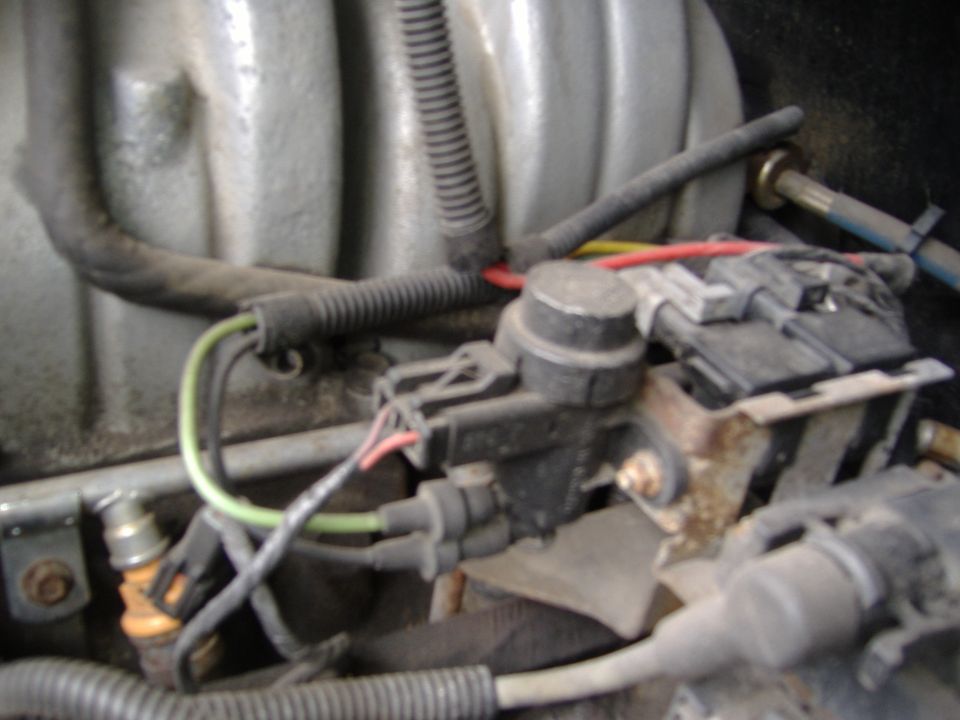 Close-up of engine wiring, sensors, and connectors