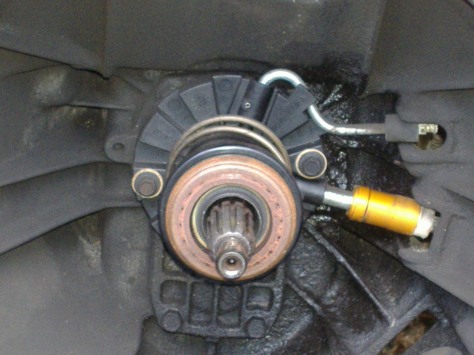 Close-up of a clutch release bearing and fork assembly, likely from a manual transmission