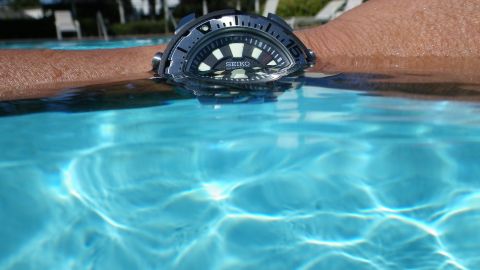 1996 Ford Bronco - A Seiko watch is partially submerged in the clear blue water of a swimming pool.