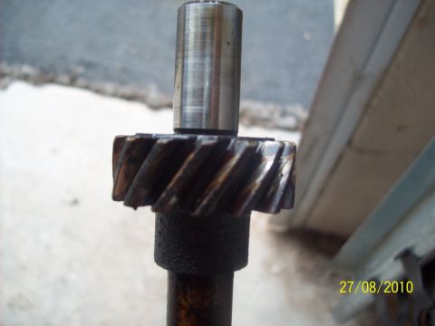 1985 Ford Bronco - A close-up view of a gear and shaft, likely a mechanical component from a vehicle.