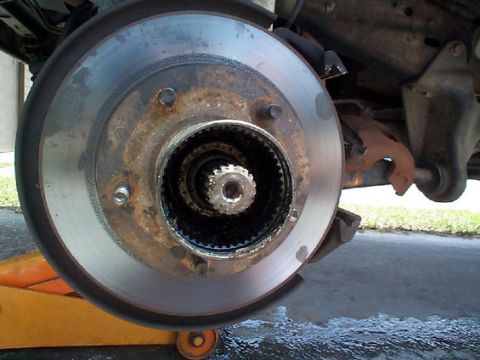 1992 Ford Bronco - Hub assembly removed, but now I can get the ring off that goes over the last axle nut. Wound up having to use a hammer a screwdriver to mot…