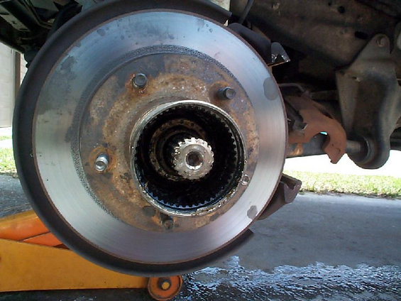 Hub assembly removed, but now I can get the ring off that goes over the last axle nut. Wound up having to use a hammer a screwdriver to motivate it. The spindle was already trashed