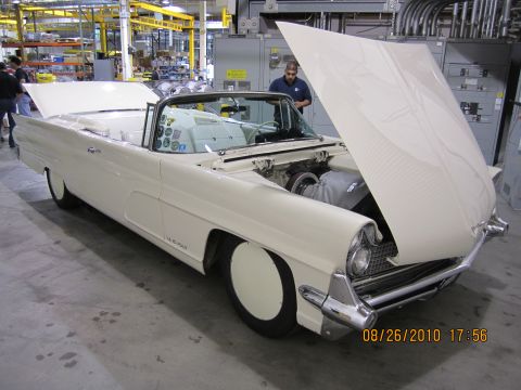 1996 Ford Bronco - A classic convertible is displayed with its hood open, revealing the engine bay.