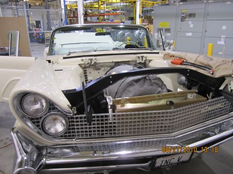 1996 Ford Bronco - Front view of a 1958 Ford Thunderbird convertible during assembly or repair.