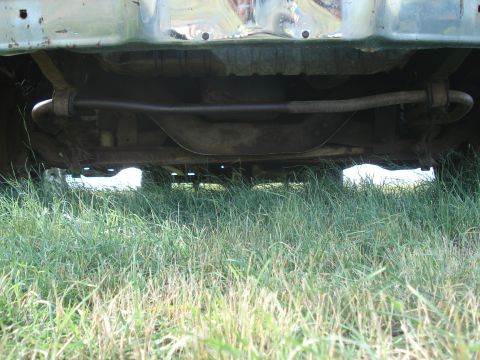 1979 Ford F-150 - The photo shows the undercarriage of a vehicle, focusing on the front sway bar and suspension system.