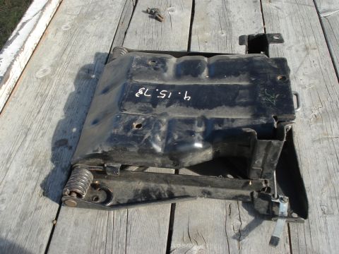 1979 Ford Bronco - This automotive part, possibly from a 1979 vehicle, is shown on a wooden surface.