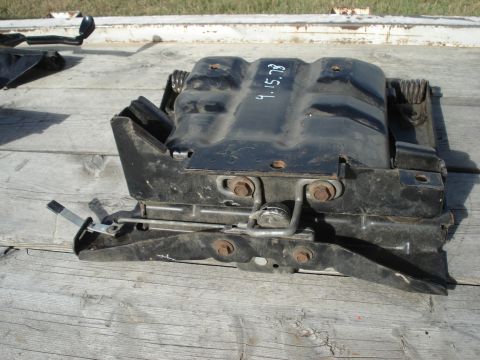 1979 Ford Bronco - A black metal seat bracket is shown, with the date 9.15.79 written on its surface.