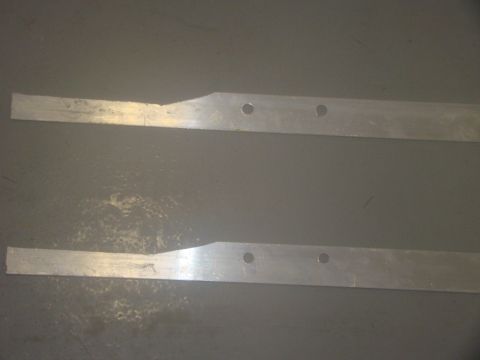 2008 Ford F-250 - Two metal strips with pre-drilled holes are shown against a plain gray background.