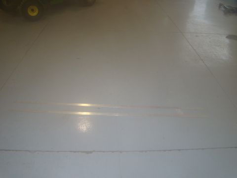 2008 Ford F-250 - A tractor is partially visible on a light gray floor.