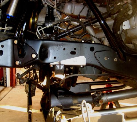 1996 Ford Bronco - Front suspension components of a vehicle, including frame, shocks, and drive shaft.