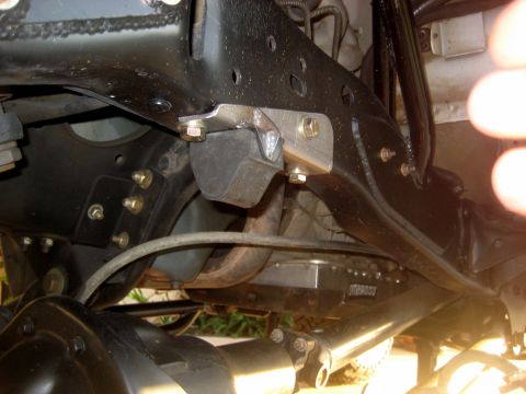 1996 Ford Bronco - Undercarriage view showing suspension components and a Moroso branded part attached to the frame.