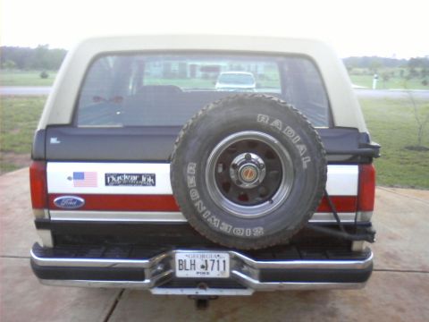 1990 Ford Bronco - This Ford Bronco has a spare tire on the rear door and a 'Duckwar Jok' sticker on the side.